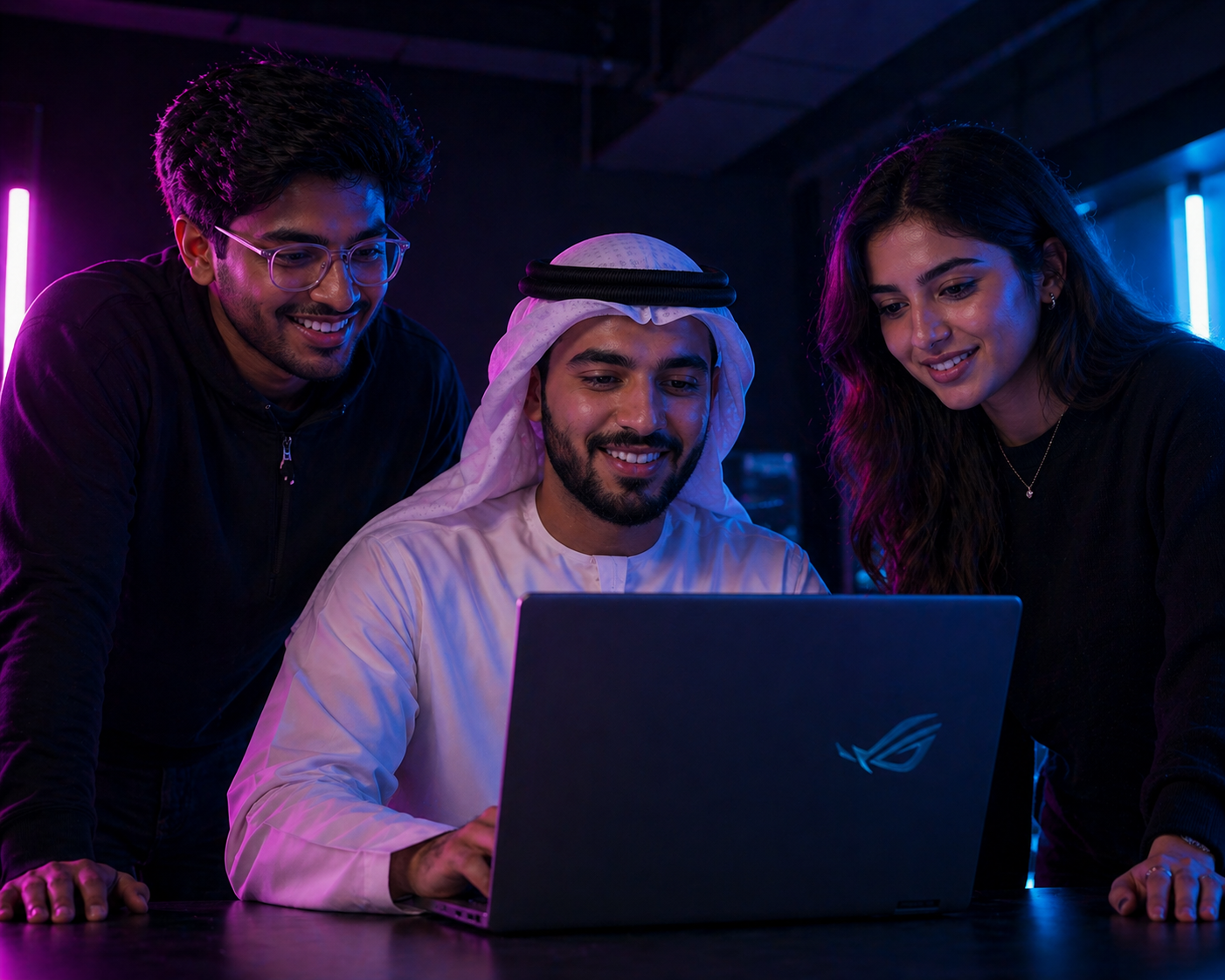 People looking at a laptop